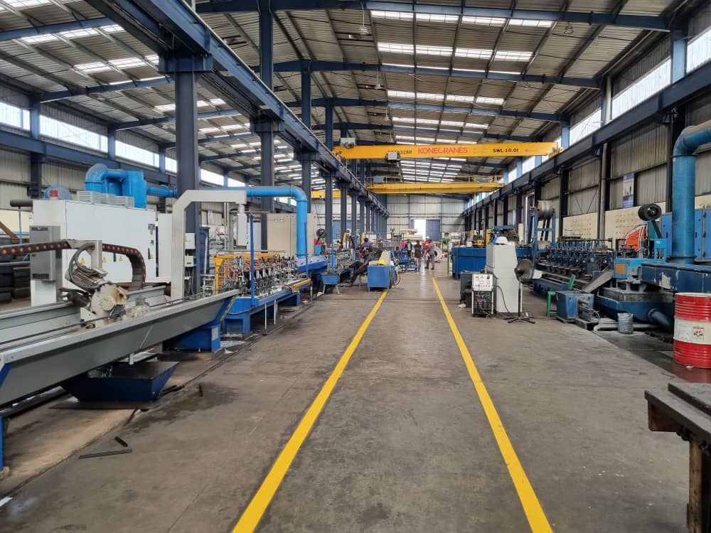Wide view of the RSG production hall with yellow walkway lines